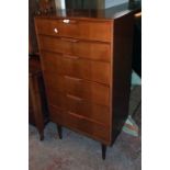 A 25 1/4" vintage teak effect and mixed wood chest with flight of six long graduated drawers, set on