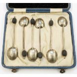 A cased set of six silver coffee bean spoons - various condition