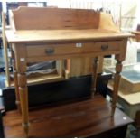 A 36" Edwardian waxed pine washstand with shaped splash back and long frieze drawer, set on turned
