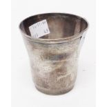 A 2 3/4" white metal tapered beaker with floral and butterfly decoration and bearing initials - base