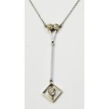 A marked 18c Art Deco white metal pendant necklace, set with three old cut diamonds to articulated