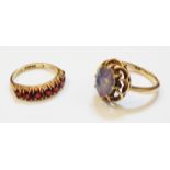 Two hallmarked 375 gold rings, one set with seven garnets, the other with doublet opal cabochon