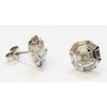 A pair of hallmarked 750 white gold stud ear-rings, each set with central brilliant cut diamond