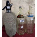 A mesh covered soda syphon - sold with two others