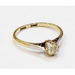An 18ct. gold and platinum diamond solitaire ring