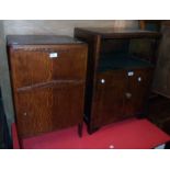 A 20th Century polished oak and mixed wood two door cabinet with recess - sold with a similar