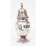 A silver sugar caster of faceted baluster design - Birmingham 1926