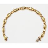 A 9ct. gold diamond set fancy link bracelet