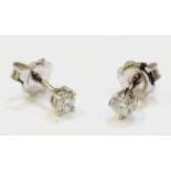 A pair of hallmarked 18ct. white gold diamond solitaire stud ear-rings - approx 0.40ct. TDW