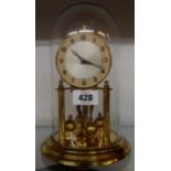 A vintage Koma anniversary clock under glass dome