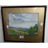 E. Buckley: a framed and gilt slipped watercolour depicting a country view with wall in