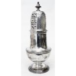 A 7 1/2" Scottish silver baluster sugar caster with decorative pierced top in the Georgian style -