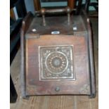 A Victorian stained oak slope fronted coal box carcass with applied decorative embossed copper panel