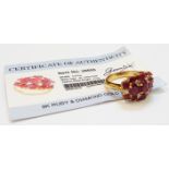 An unmarked ruby and diamond cluster ring with certificate