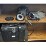A Yashica FX-3 camera with Medical 100 DX strobe lens and a power pack