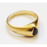 A 1989 Thai yellow metal ring, set with deep cut dark sapphire - complete with original receipt