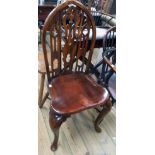 A stained wood Gothic style high mitre back standard chair with pierced splats and moulded solid