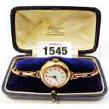A late 19th Century J. W. Benson watch box containing an import marked 9/375 rose gold lady's