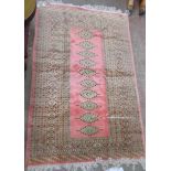 A vintage Princess Bokhara fringe end wool rug with single row of medallions within multi borders