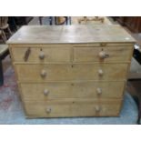 A 3' 4 1/2" 19th Century stripped pine chest of two short and three long graduated drawers - feet