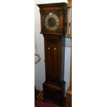 A 20th Century polished oak longcase clock with decorative square dial and triple weight driven