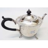 A Mappin & Webb silver teapot with shaped rim, set on stylised paw pattern feet - Sheffield 1915