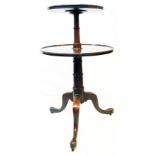 A 19th Century mahogany two tier dumb waiter, set on turned pillar and tripod base with brass roller