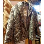 A vintage faux leopard skin coat
