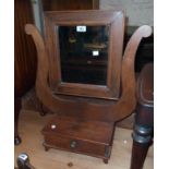 An old adapted dressing table mirror with lyre pattern supports and drawer base