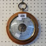 A retro Weathermaster polished wood cased fob style wall barometer with visible aneroid works to