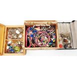 Three small boxes containing assorted costume jewellery