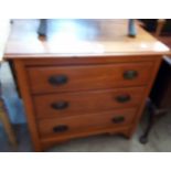 A 33" Edwardian satin walnut chest of three long graduated drawers, set on bracket feet - from a