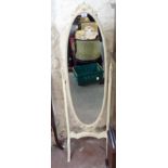 A French style cream painted and parcel gilt framed cheval mirror with oval plate, pierced and