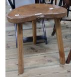 Robert "Mouseman" Thompson: a varnished oak cow stool with classic carved mouse motif to front of