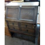 A 29 1/2" early 20th Century polished oak bureau with part fitted interior, two long drawers and