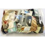 A bag containing a collection of mainly carded and boxed as new costume jewellery