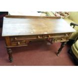 A 3' 10 1/2" 19th Century mahogany writing table with low raised back, two frieze drawers and two