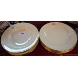 A quantity of Minton dinner plates with gilt cipher - sold with two matching soup bowls