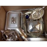 A quantity of silver plated items including muffin dish, cake baskets, gravy boats, condiments,