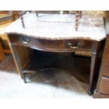 A 36" late 19th Century mahogany serpentine front washstand with shaped marble top, long frieze