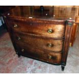 A 3' 2 1/4" 19th Century mahogany break bow front chest with cross banded and strung top, flanking