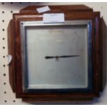 A 1930`s polished oak framed aneroid wall barometer with faded square dial