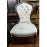 A late Victorian walnut part show frame spoon back drawing room chair with button back floral