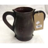 A stitched leather two handled tankard