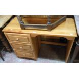 A 3' 4" modern polished pine faced single pedestal knee-hole dressing table with three drawers
