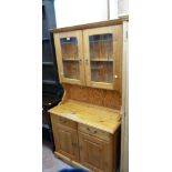 A 3' 2" late 20th Century polished pine two part dresser with leaded effect glazed panel doors to