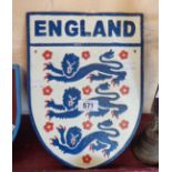 A reproduction painted cast iron England football sign