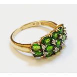 A hallmarked 375 gold diopside and tiny diamond set ring