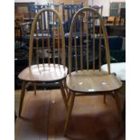 Two similar Ercol high hoop stick back kitchen chairs with moulded solid elm seats, one bearing