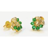 A pair of import marked 375 gold stylised floral panel ear-rings, each set with four emeralds and
